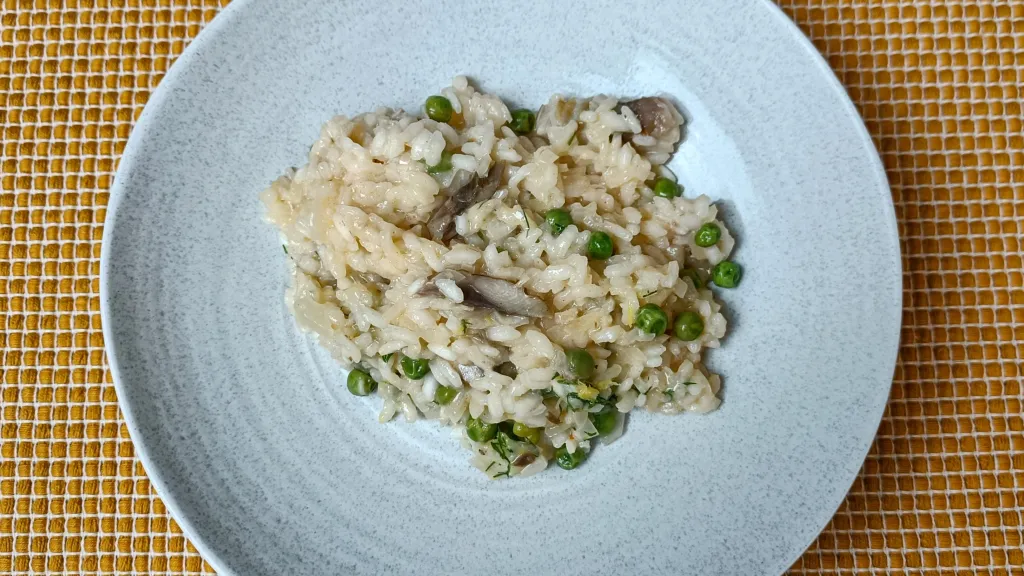 Photograph of Risotto with smoked mackerel, peas and lemon.