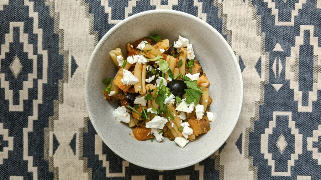 Photograph of Sardine & aubergine puttanesca with feta.