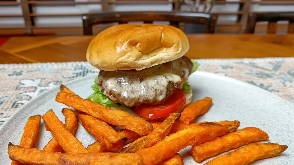 Photograph of Spicy cheese and bacon burgers.