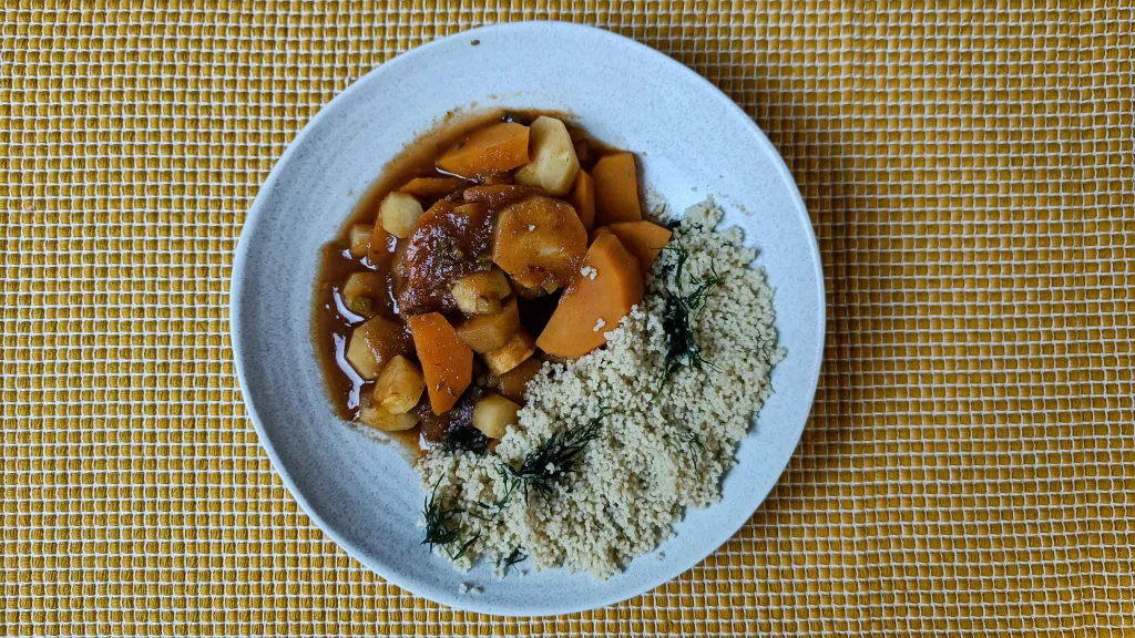 Photograph of Sweet potato & parsnip tagine with dates & coriander.